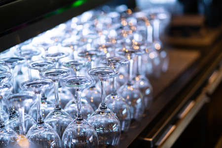 Image of Lines of wine glasses on the wooden table in the pubの写真素材