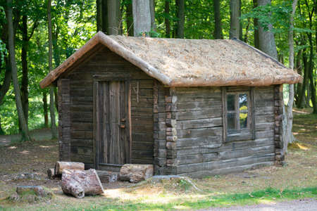 hImage of house of the hunter from a saw log in the forestの写真素材