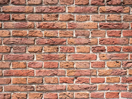 Old brick wall, an old texture of red stone blocks closeupの写真素材