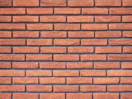 Old brick wall, old texture of red stone blocks closeupの写真素材