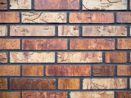 Old brick wall, an old texture of red stone blocks closeup