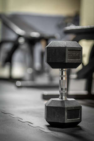 Image of metal dumbbell exercise weights on the floorの写真素材