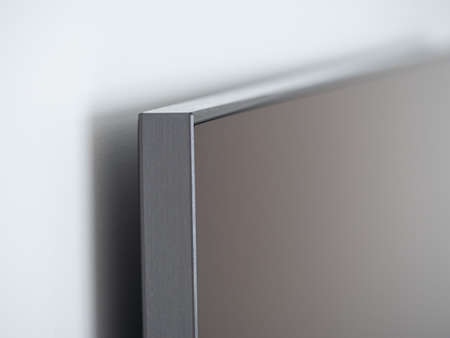 image of Blank modern flat screen TV seamlessly attached to the white wallの写真素材