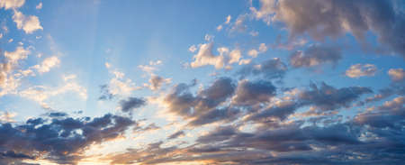 Vibrant color panoramic sun rise and sun set sky with cloud on a cloudy day.の写真素材