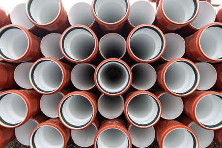 background of colorful big plastic pipes used at the building site.の写真素材