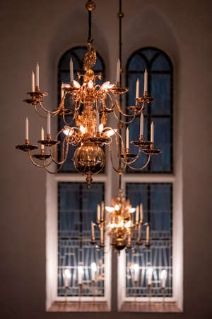 Candles Lit on the Chandelier in Orthodox Churchの写真素材