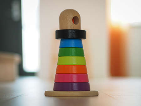 Multicolored wooden toy pyramid On the wooden floorの写真素材