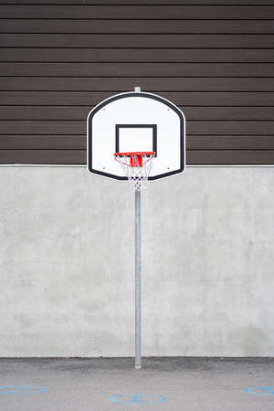 Basketball shield with basket on the pillarの写真素材