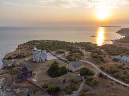 Aerial drone shot of the sunset over the lighthouse at Stora Karlso, Swedenの写真素材
