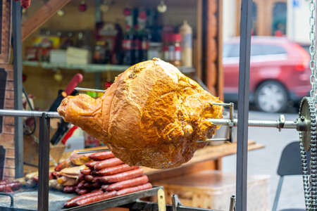 Lots of fresh made tasty meat on a grill, bbq closeup, steam over hot food, sausages, shashlik sold on a street food festival, market stall outdoors, outside. Grilled meat dishes, barbecue conceptの写真素材