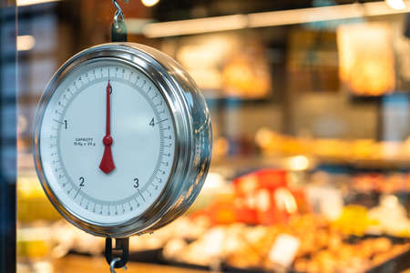 Round weight scales at the supermarket vegetables departmentの写真素材