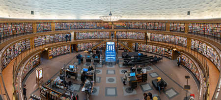 Stockholm, Sweden, January 18, 2022: Interiour of the famous public library stadsbiblioteket in Stockholm, architect Gunnar Asplund with many books on the shelfs.のeditorial素材