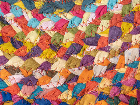 image of braided multi colored woollen yarns