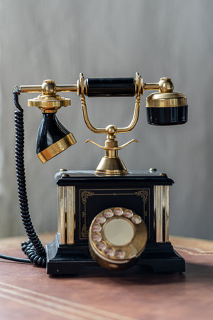Old antique vintage traditional black phone with disc dials the 19th centuryの写真素材