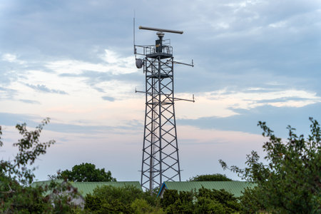 Telecommunication tower with 5G cellular network antenna on city background