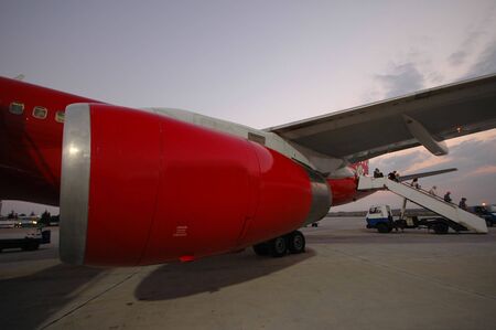 Red plane in an airport.の写真素材