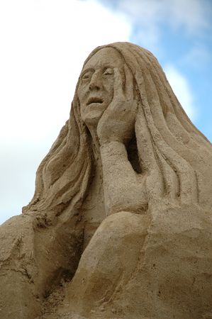 Sand sculpture of a sad womanの写真素材