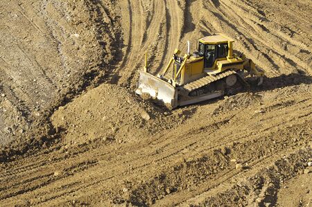 Bulldozer is working in a mine