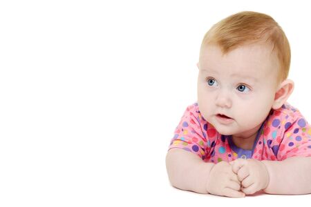 A sweet happy baby 3 month young. Resting on af white background.の写真素材