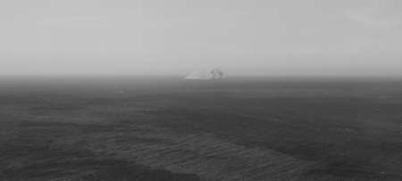 Ice iceberg in the cold North sea. Black and white, monochrome photo.の写真素材