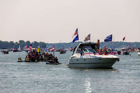 Mooresville, NC, USA - July 4, 2020: Boats flying Trump 2020 flags for President Donald Trump on Lake Norman near the Trump National Golf Club Charlotteのeditorial素材