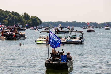 Mooresville, NC, USA - July 4, 2020: Boats flying Trump 2020 flags for President Donald Trump on Lake Norman near the Trump National Golf Club Charlotteのeditorial素材