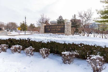 Dayton, OH, USA: University of Dayton sign, with fresh winter snow on the ground.
