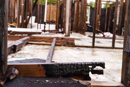Burnt wood in home after house fire destroyed it.の写真素材