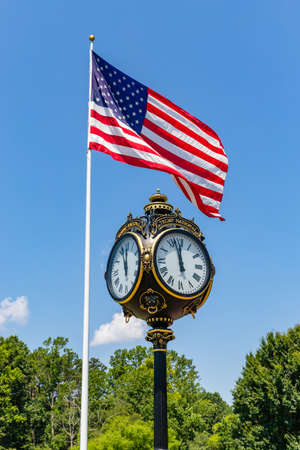 Mooresville, NC, USA: Clock and American Flag at the Trump National Golf Club Charlotte