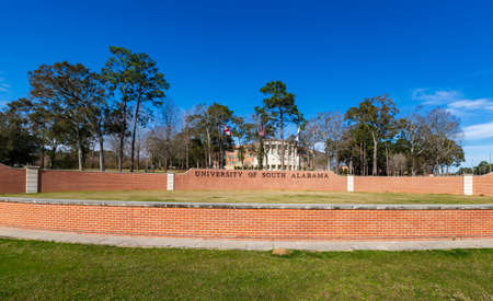 Mobile, AL - January 30, 2021: The University of South Alabama sign and flagsのeditorial素材