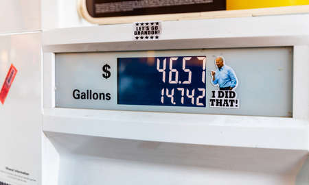 2021: President Joe Biden "I did that" sticker on fuel pump, referencing gas prices.のeditorial素材