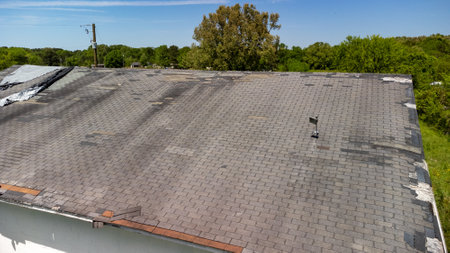 Roof missing shingles due to age, weather and storm damage