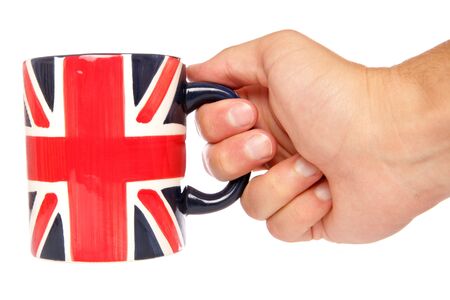 Hand holding british mug studio cutoutの写真素材