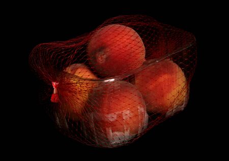 tub of peaches isolated on black backgroundの写真素材