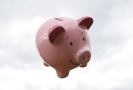 Piggy Bank flying in the skyの写真素材