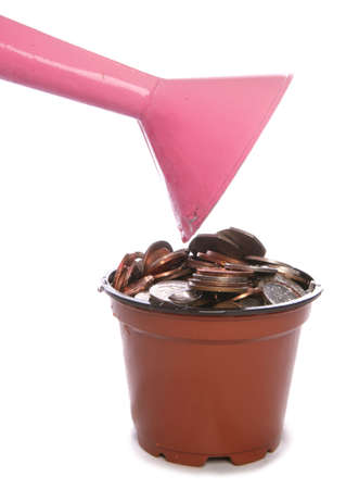 Sterling Money in plant pot being watered studio cutoutの写真素材