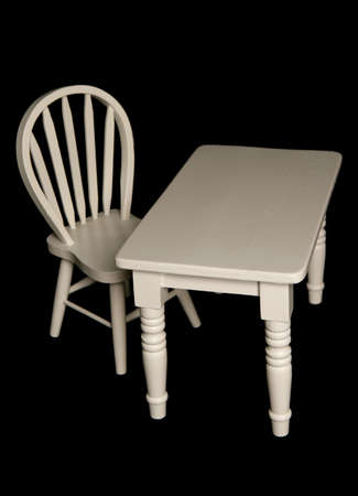 Table and chair isolated on black backgroundの写真素材