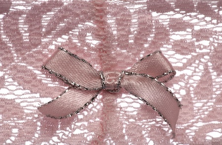 Pink lace pattern with bow background textureの写真素材
