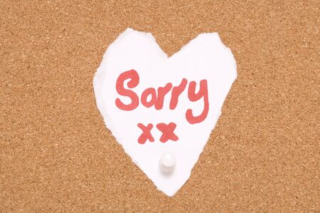 Sorry sign on cork notice board abstractの写真素材