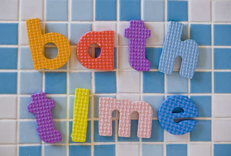 bath time on white and blue tiles abstractの写真素材