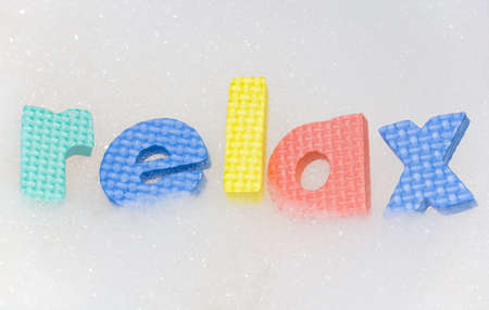 relax letters in bubble bath foam abstractの写真素材