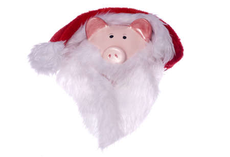 Piggy bank wearing a santas hat and beard cutoutの写真素材