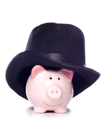 piggy bank wearing a top hat studio cutoutの写真素材
