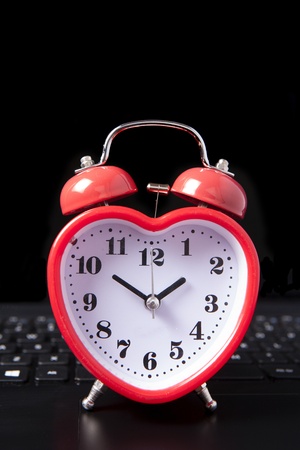 heart clock on a laptopの写真素材