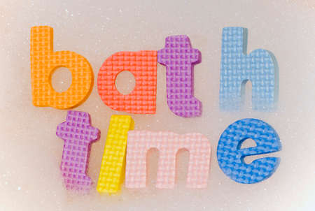 Bath time foam letters in bubblesの写真素材