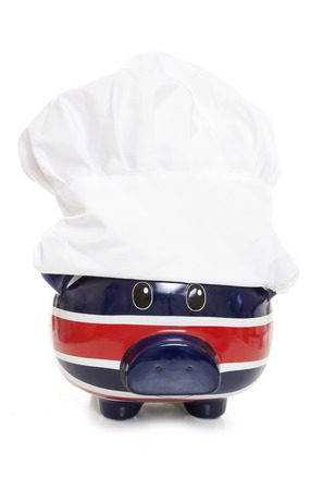 piggy bank wearing a chefs hat cutoutの写真素材