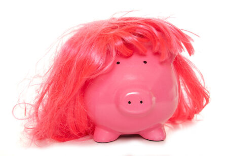 piggy bank wearing pink wig cutoutの写真素材