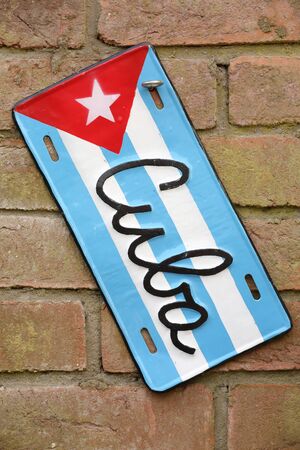 Cuba flag sign on a brick wallの写真素材
