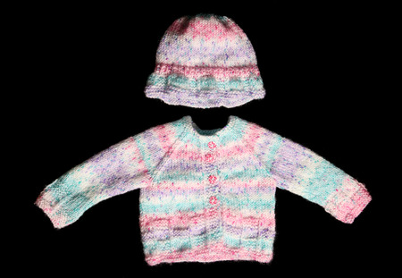 knitted wool jumper on black backgroundの写真素材