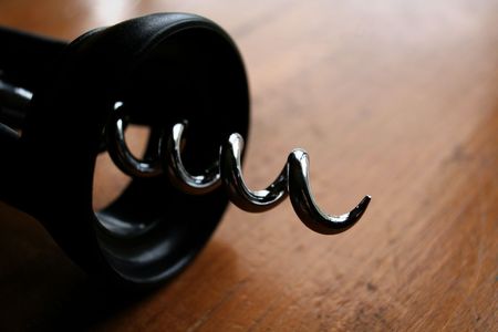 A corkscrew sitting on a table.の写真素材
